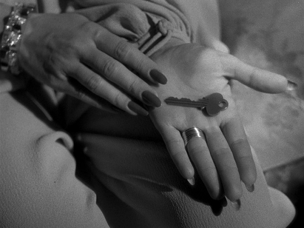 key in joan bennett's hand